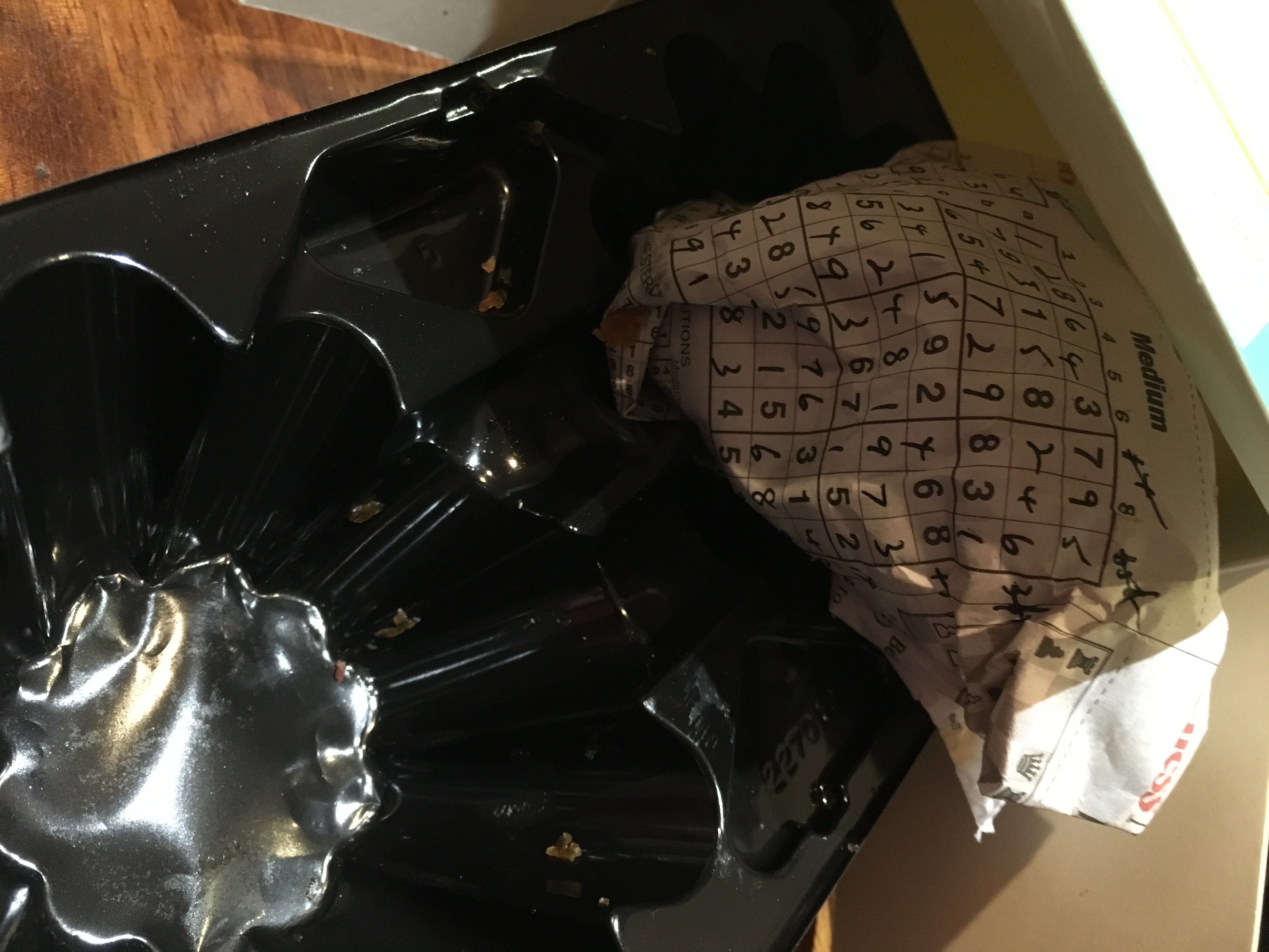 add packing to tray to box